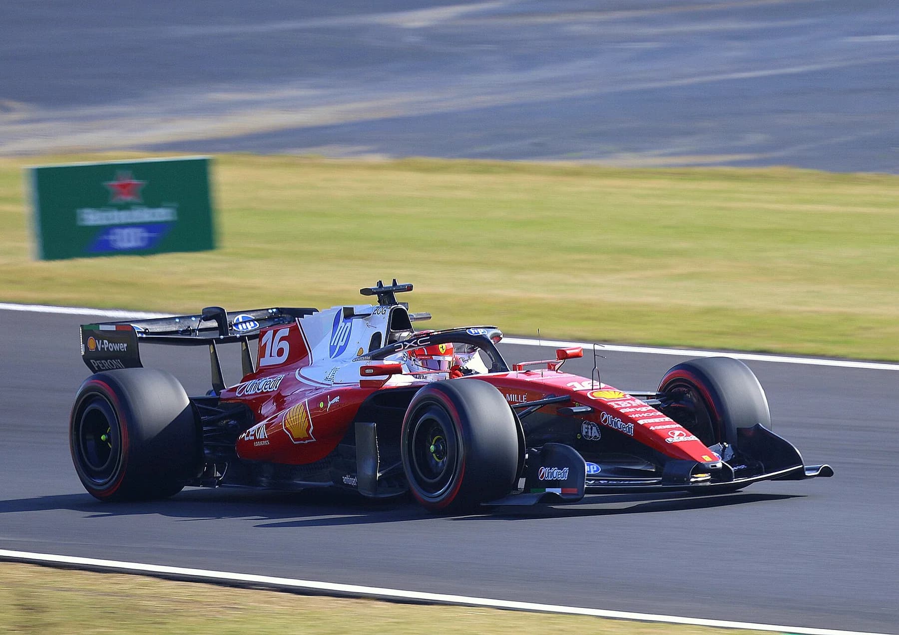 Charles Leclerc approaches Spoon Curve in the Ferrari SF-26 at Suzuka during the 2026 Japanese Grand Prix weekend.